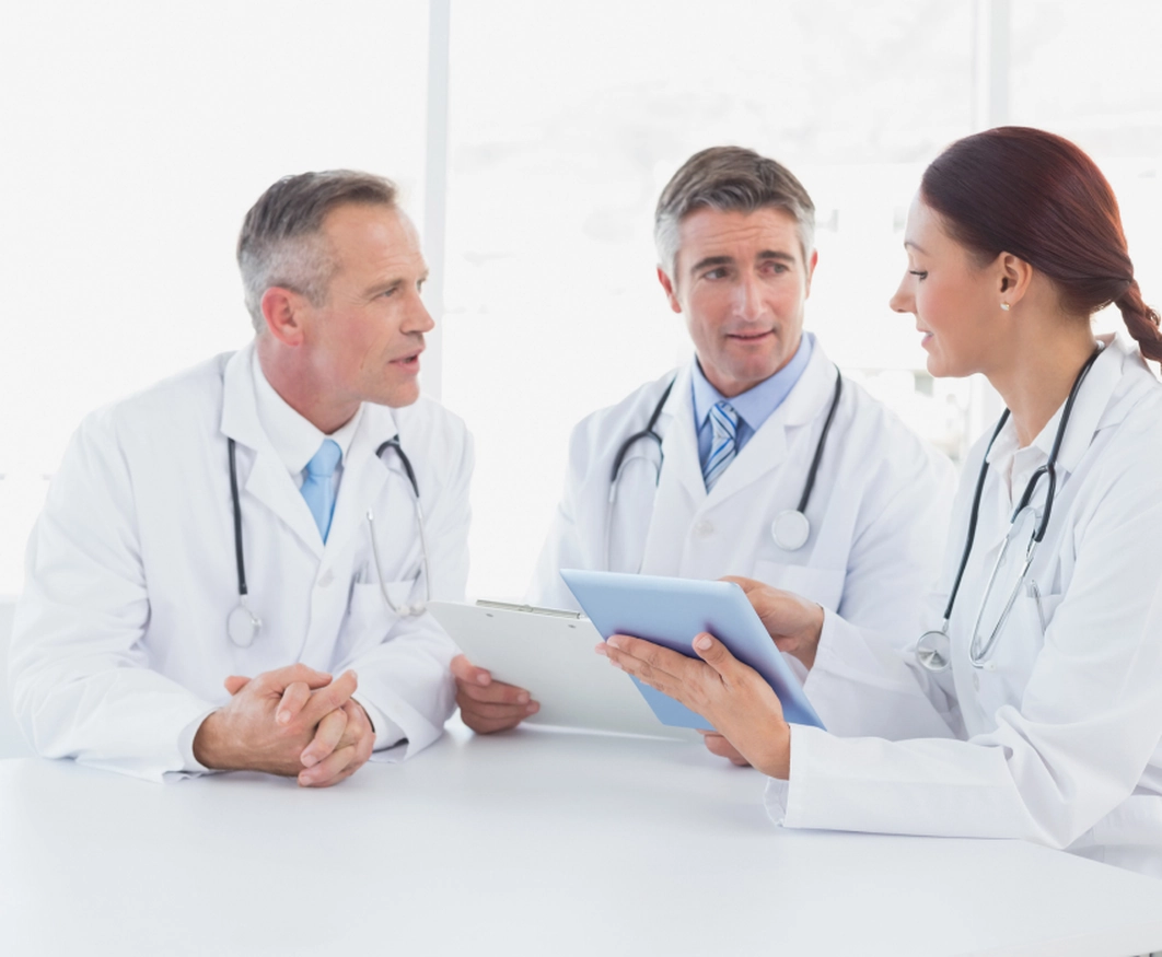 Physicians discussing the advantages of partnering with RCM Experts for Epic billing